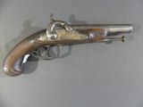 a gun that is on display on a table