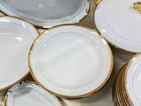 a lot of plates that are sitting on a table