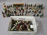 a box full of assorted liquor bottles on a table
