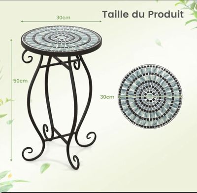 the table is made of metal and has a mosaic pattern on it