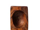 a wooden bowl that is sitting on a white surface
