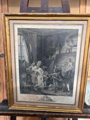 une vieille photo représentant un tableau posé sur un chevalet en bois dans une pièce