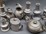 many different types of silver teapots and teapots