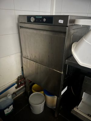 an image of a commercial kitchen with a washer and buckets