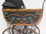 a baby carriage with a baby in it on display