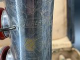 a silver vase that is sitting on a table