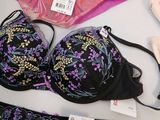 many different bras and underwear on display on a table