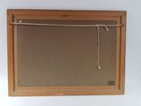 a picture of a mirror hanging on a wall