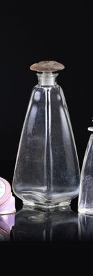 two glass bottles with a wooden top and a small glass bottle with a wooden top