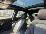 the interior of a car with a sunroof and a view of the street