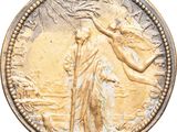 a close up of a coin with an angel on it