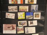 a black refrigerator with many different stamps on it
