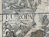an old map of europe with a man on a horse in the foreground