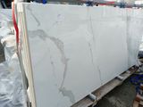 white marble slabs on a pallet in a warehouse