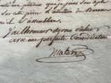 an old letter written in french on a piece of paper