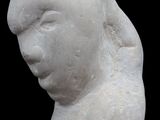 marble statue of a woman ' s head on a black background