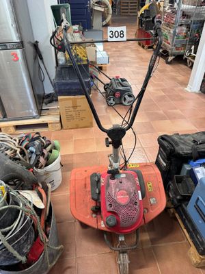 an image of a small lawn mower in a store