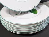 many plates stacked on top of each other on a table