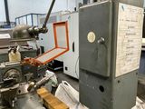a machine that is sitting in a factory with a lot of machinery