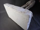 a large piece of cement sitting on top of a black cloth