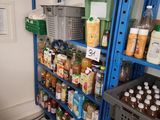 a blue shelf filled with lots of food and drinks