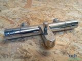 an image of a stainless steel pipe on a wooden surface