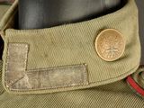 a close up of a military uniform with a coin on the collar