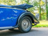 a blue car parked on the side of the road