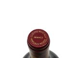 a bottle of wine that is sitting on a table