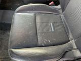 a dirty seat in the back of a car