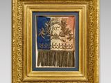 a gold frame with a picture of a dragon and a banner