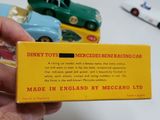a person holding a box with a toy car in it