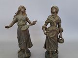 paire de figurines anciennes en bronze représentant une femme et un homme