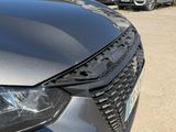 the front end of a car with a denting dent on it ' s head