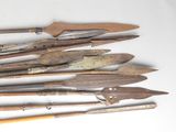 a lot of different types of knives on a table