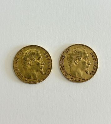 two gold sovereigns, one with the head of a man and one with a woman