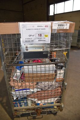 a metal cart with a lot of items in it