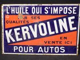 une enseigne portant l'inscription « Kervoline » sur le mur d'un immeuble