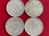 trois pièces d'argent britanniques, dont l'une comporte une couronne et l'autre est ornée d'une couronne