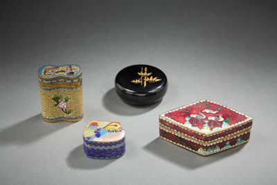 three small boxes are sitting next to each other on a table