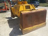 a bulldozer that is sitting in the dirt