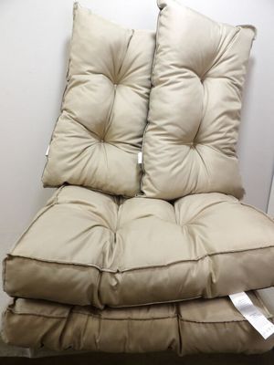 two pillows on top of each other on a chair