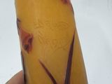 a hand holding a banana that has been painted with flowers on it