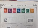 a book with different stamps on it on a table