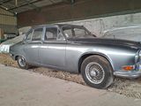 a silver car that is parked in a garage