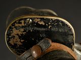 a close up of a pair of shoes with a leather strap