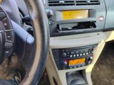 dashboard view of a car with a steering wheel and dashboard controls
