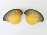 pair of yellow and black underwired bras on a white surface