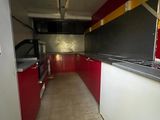 an image of a kitchen with red and white cabinets