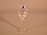 a wine glass that has a blue sticker on it